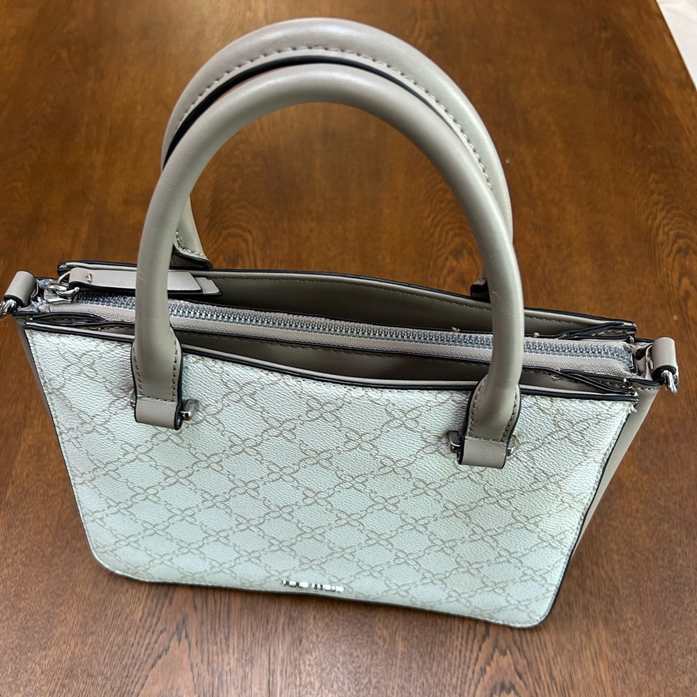 NineWest Handbag -approx 11x4x8.5” in fresh Beige Logo/Milk design. Dbl handles